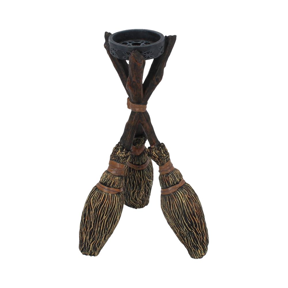 These three Brooms support a small tealight holder.