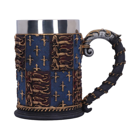 Fleur-De-Lys and golden lions sit on a fields of red and blue on this tankard.