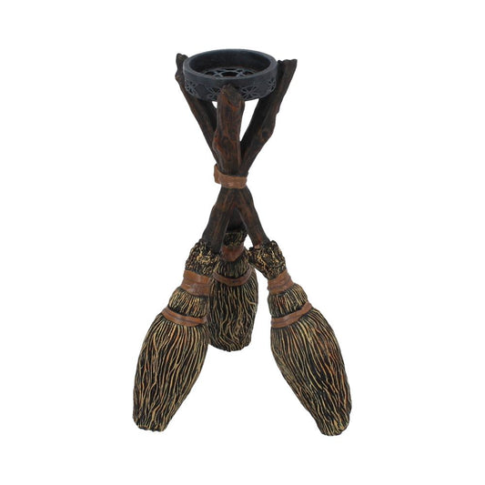 These three Brooms support a small tealight holder.