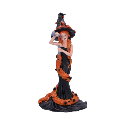 Orange cinnamon inspired witch figurine