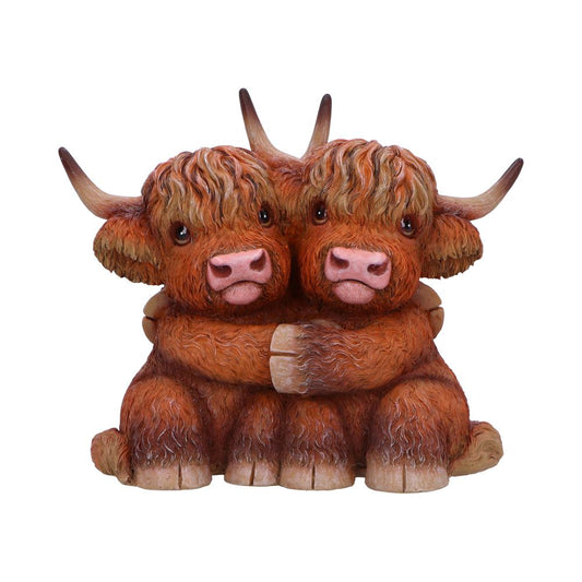 Figurine featuring two Highland Cows sharing a hug