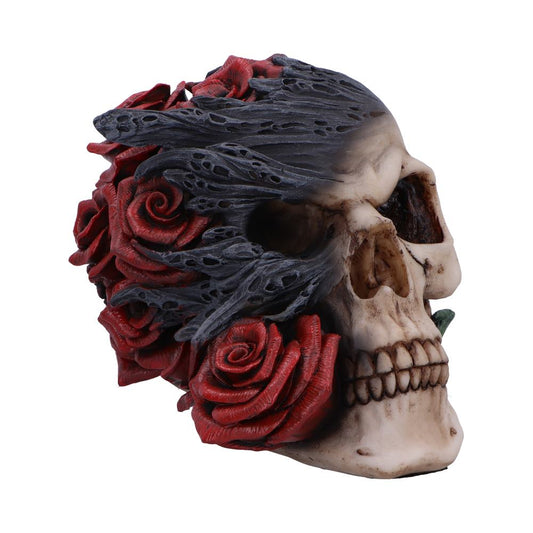 Detailed resin skull with smoky tendrils and red roses.