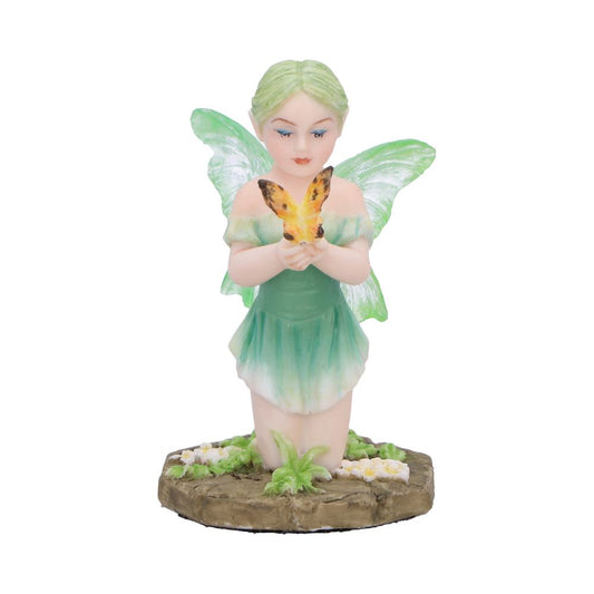 Kneeling fairy atop a rock base, surrounded by flowers and grass.