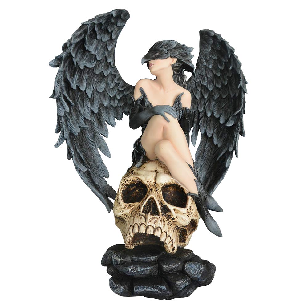 Gothic resin figurine of a feathered-winged woman seated on a skull