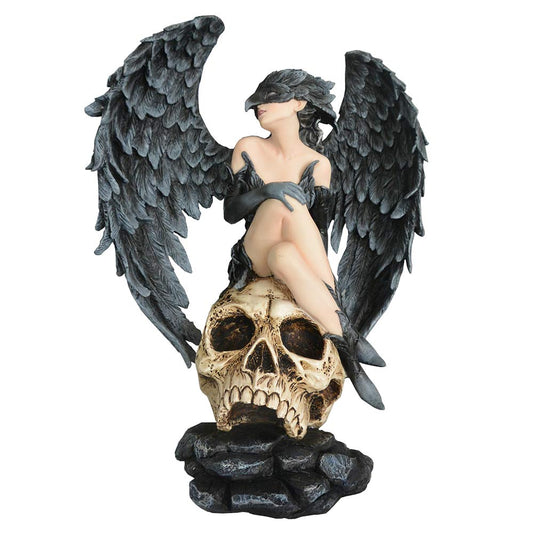 Gothic resin figurine of a feathered-winged woman seated on a skull