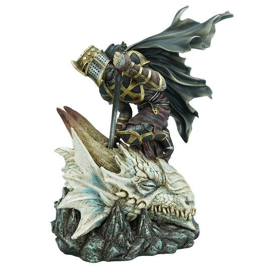 Detailed resin figurine of a kneeling knight atop a slain dragon
