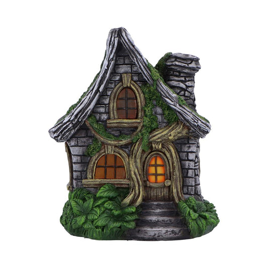 A whimsical fairy cottage with LED lighting that creates a warm, inviting glow.